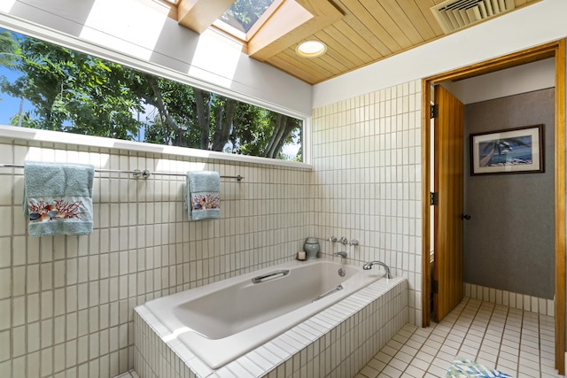 4000 Wailea Alanui Dr Unit 502, Kihei, HI 96753 - full bath with tile patterned floors, a skylight, and a garden tub