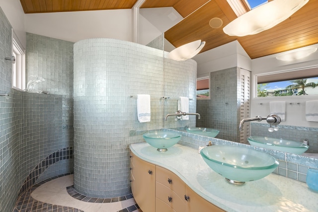 4000 Wailea Alanui Dr Unit 502, Kihei, HI 96753 - bathroom featuring tile walls, wood ceiling, double vanity, tile patterned flooring, and vaulted ceiling