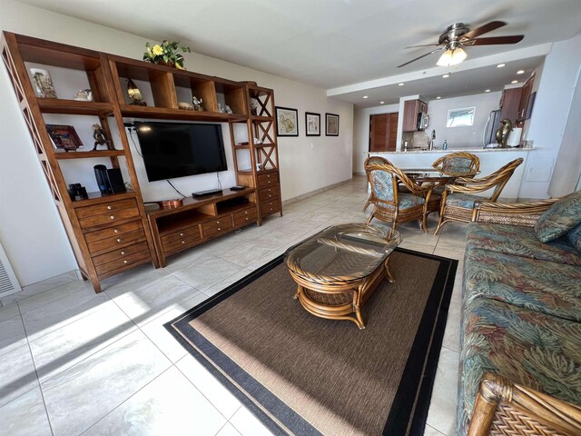 living area with light tile patterned floors, recessed lighting, and ceiling fan