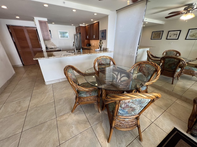dining space with light tile patterned floors, recessed lighting, and a ceiling fan