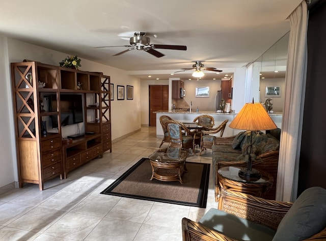 living area featuring light tile patterned floors, ceiling fan, and recessed lighting
