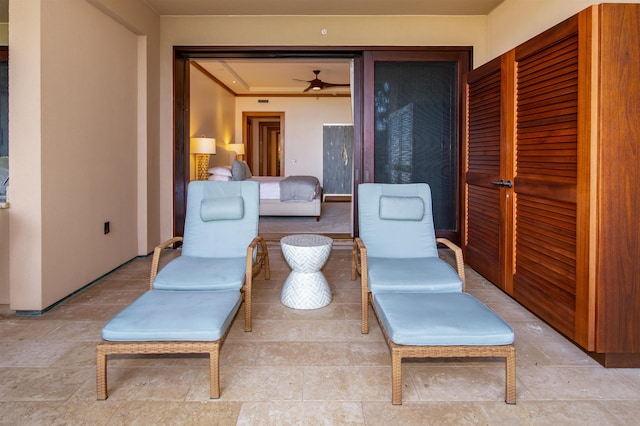 living area featuring ceiling fan