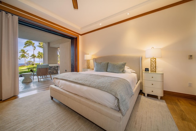 bedroom with ceiling fan, crown molding, light hardwood / wood-style flooring, and access to outside