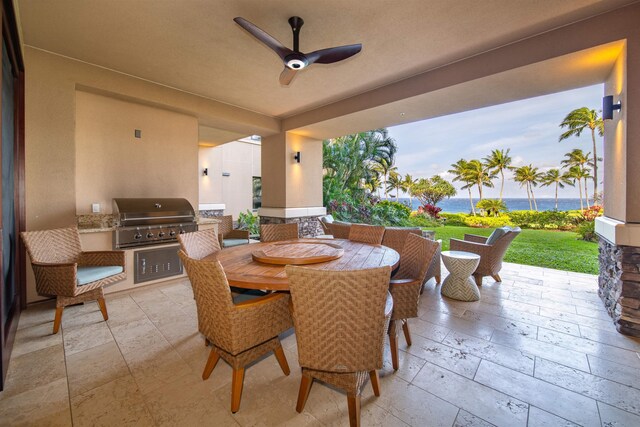 view of patio / terrace with ceiling fan, a grill, a water view, and area for grilling