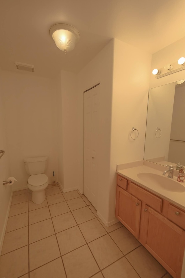 40 Halili Ln Unit 4J, Kihei, HI 96753 - half bathroom with tile patterned floors, toilet, vanity, and baseboards