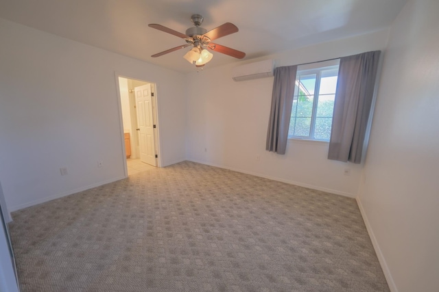 40 Halili Ln Unit 4J, Kihei, HI 96753 - empty room featuring a wall mounted air conditioner, a ceiling fan, light colored carpet, and baseboards