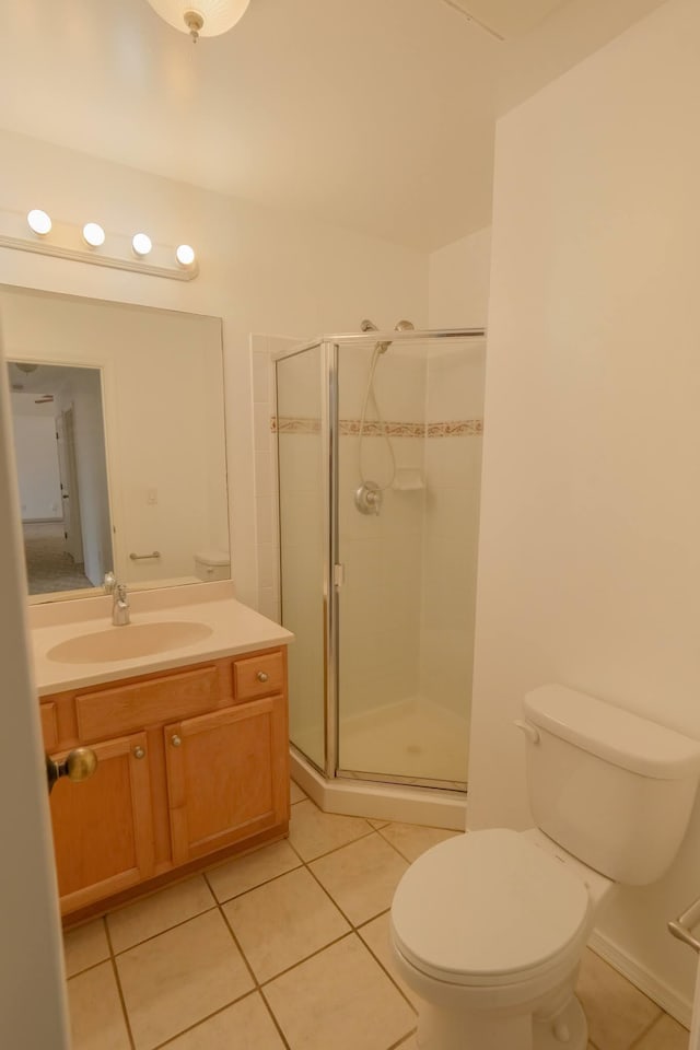 40 Halili Ln Unit 4J, Kihei, HI 96753 - bathroom with tile patterned flooring, toilet, and a shower stall