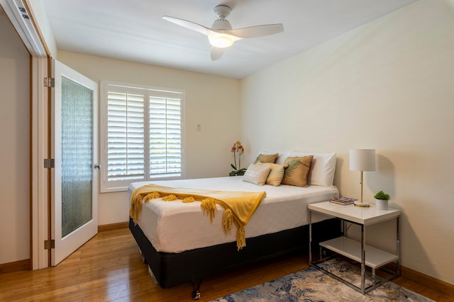 2050 Kanoe St Unit 208, Kihei, HI 96753 - bedroom featuring wood finished floors, baseboards, and ceiling fan