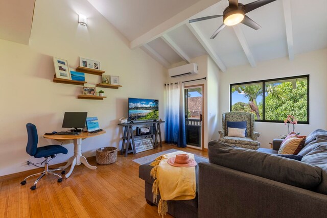 2050 Kanoe St Unit 208, Kihei, HI 96753 - living area with a wall mounted air conditioner, wood finished floors, beam ceiling, ceiling fan, and high vaulted ceiling