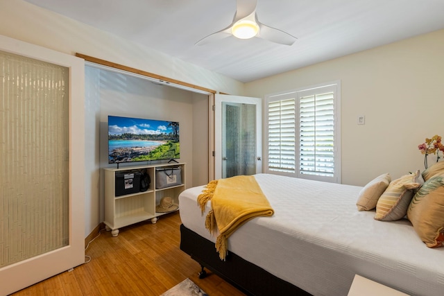 2050 Kanoe St Unit 208, Kihei, HI 96753 - bedroom featuring light wood-style flooring, ceiling fan, and baseboards
