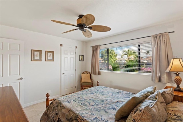 bedroom featuring ceiling fan and light tile patterned flooring