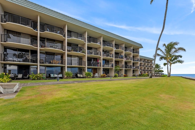 view of building exterior with a water view