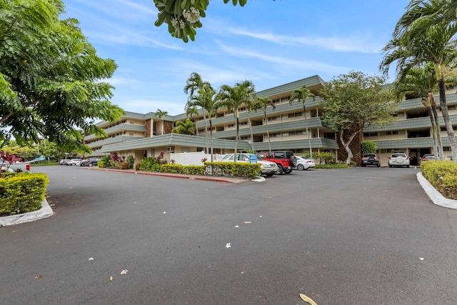 view of property featuring uncovered parking