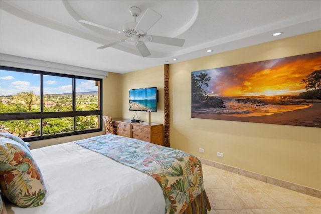 tiled bedroom featuring ceiling fan