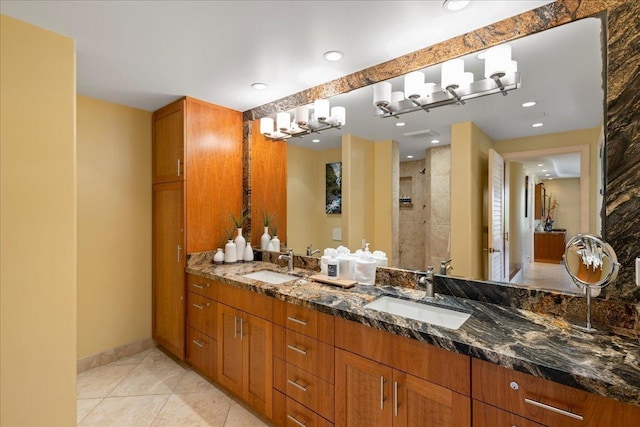 bathroom with vanity, tile patterned floors, and a shower with shower door