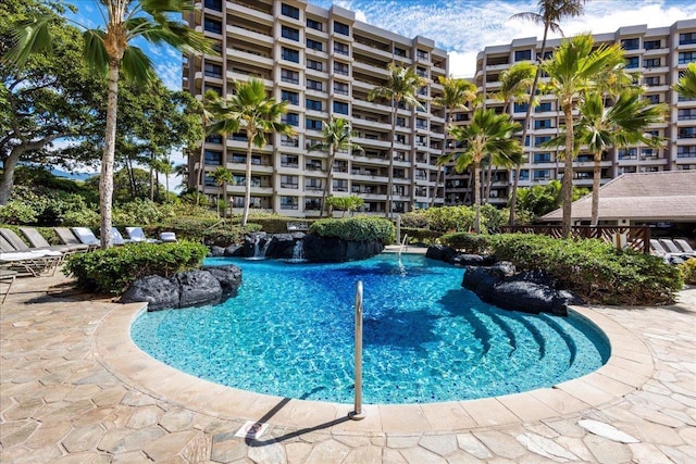 view of pool with pool water feature