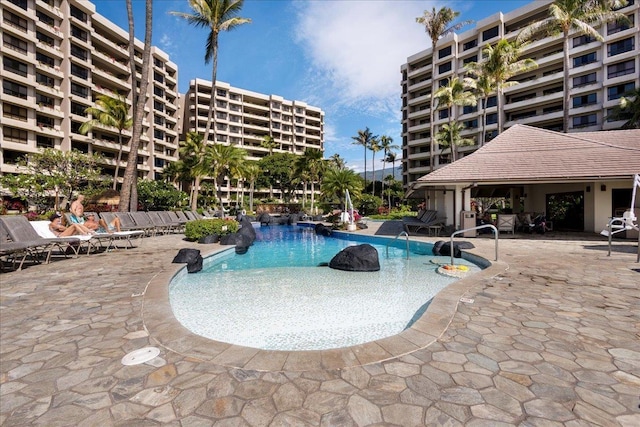 view of pool featuring a patio