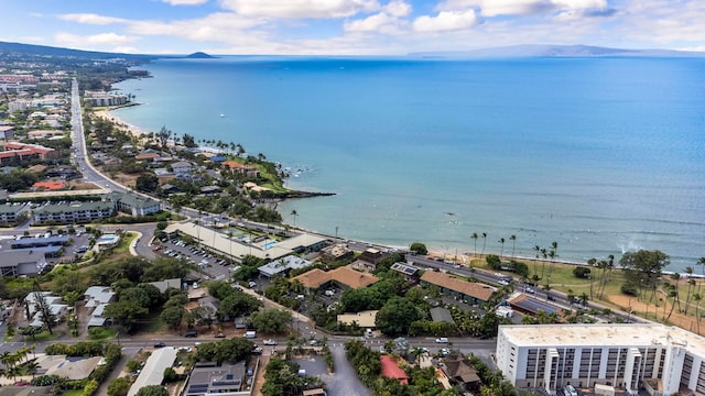 birds eye view of property with a water and mountain view