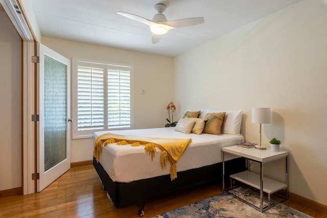 bedroom featuring hardwood / wood-style flooring and ceiling fan