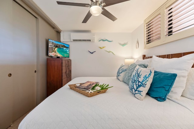 bedroom with a wall mounted AC and a ceiling fan