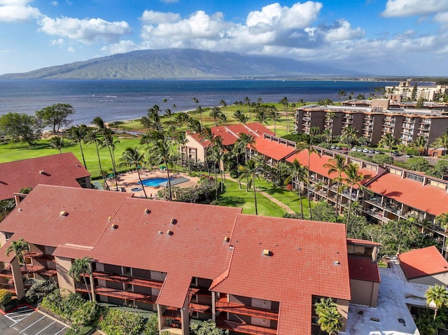 aerial view featuring a water and mountain view