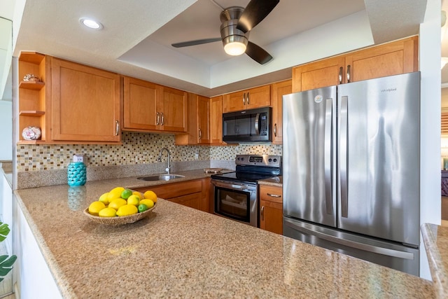 kitchen with a sink, brown cabinets, ceiling fan, open shelves, and appliances with stainless steel finishes