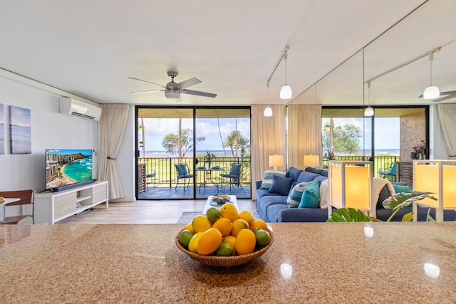 sunroom / solarium featuring a wall mounted air conditioner
