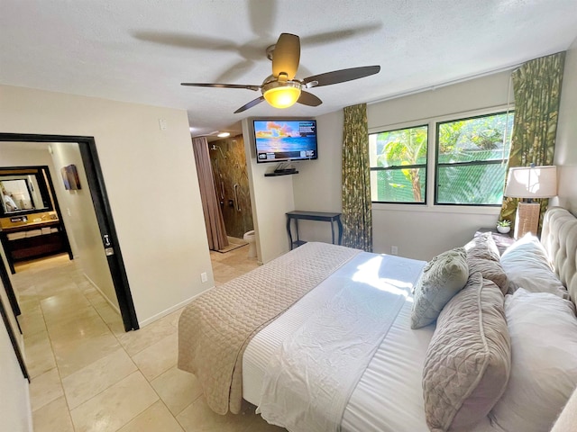 tiled bedroom featuring a textured ceiling and ceiling fan