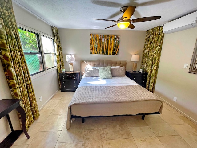 tiled bedroom with a wall mounted air conditioner, a textured ceiling, and ceiling fan