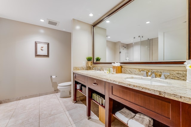 bathroom with tile flooring, dual sinks, toilet, and oversized vanity