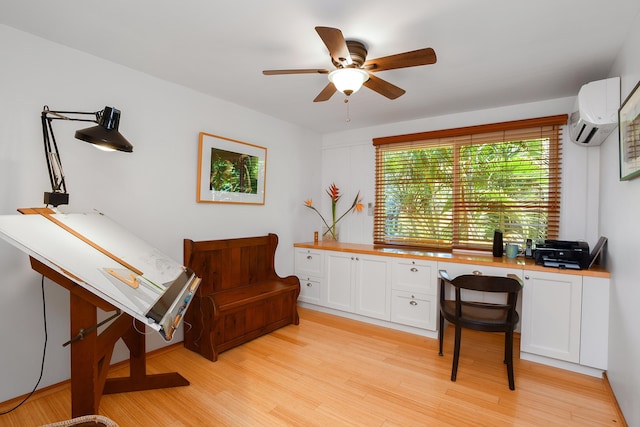 679 Kaapuni Pl, Kihei, HI 96753 - home office featuring an AC wall unit, light wood finished floors, ceiling fan, and built in study area
