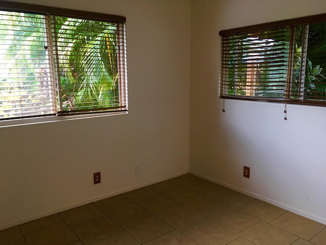 679 Kaapuni Pl, Kihei, HI 96753 - tiled empty room featuring baseboards