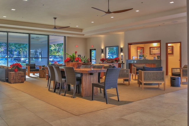 tiled dining room featuring ceiling fan