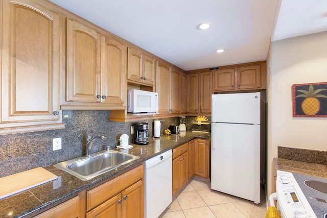 kitchen featuring light tile patterned flooring, white appliances, backsplash, and sink