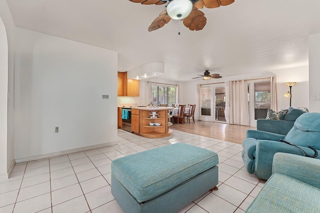 2730 Ohina St, Kihei, HI 96753 - living area featuring ceiling fan, light tile patterned floors, and baseboards