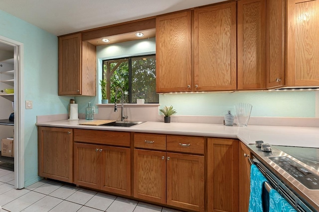 2730 Ohina St, Kihei, HI 96753 - kitchen with a sink, light tile patterned floors, brown cabinets, and light countertops