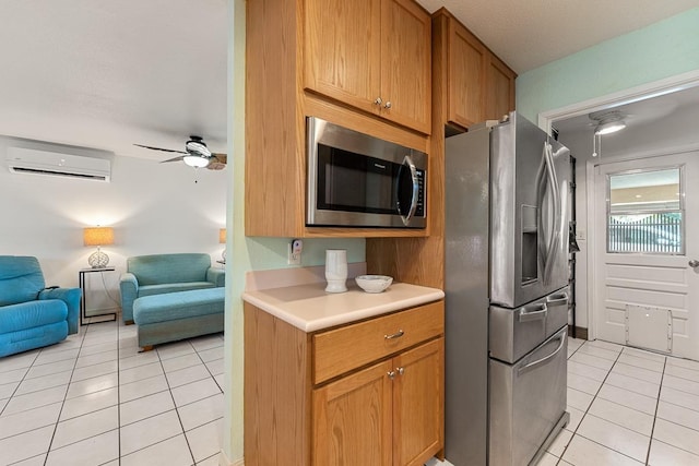 2730 Ohina St, Kihei, HI 96753 - kitchen featuring stainless steel appliances, an AC wall unit, light tile patterned floors, open floor plan, and light countertops