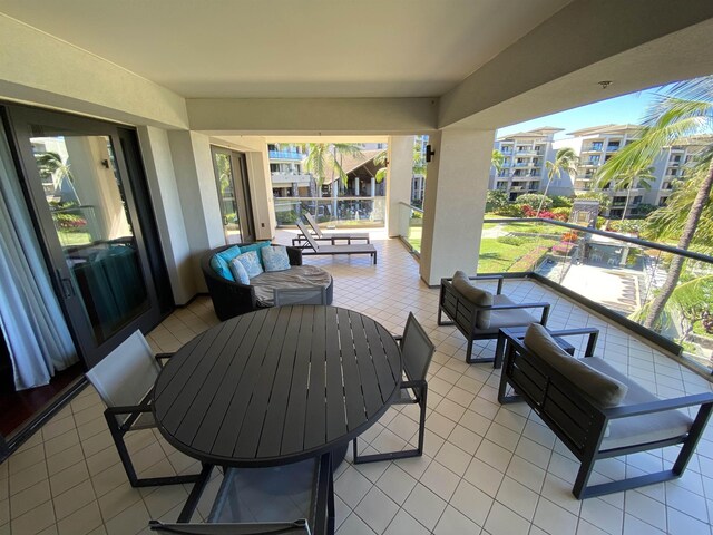 view of patio / terrace with a balcony and an outdoor hangout area