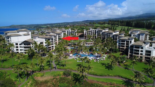 birds eye view of property featuring a mountain view