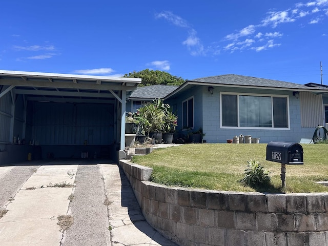 129 Niihau St, Kahului, HI 96732 - view of front of property with concrete block siding, asphalt driveway, a shingled roof, and a front yard