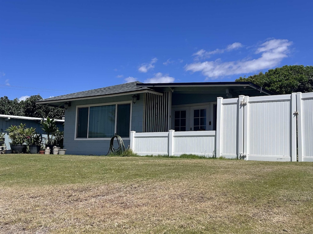 129 Niihau St, Kahului, HI 96732 - view of side of property featuring concrete block siding and a shingled roof