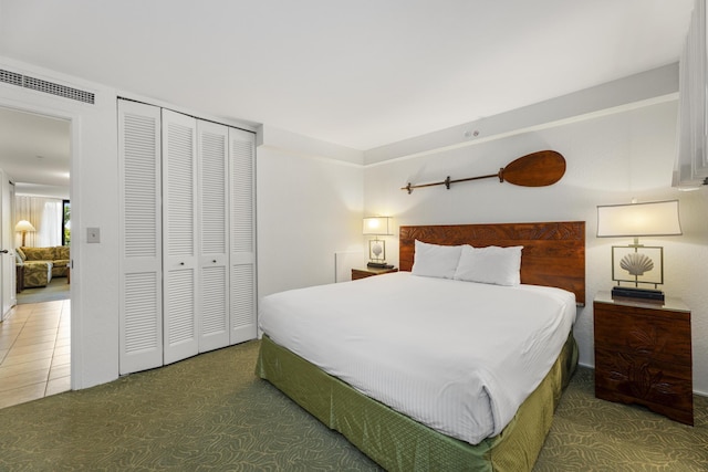 carpeted bedroom with a closet