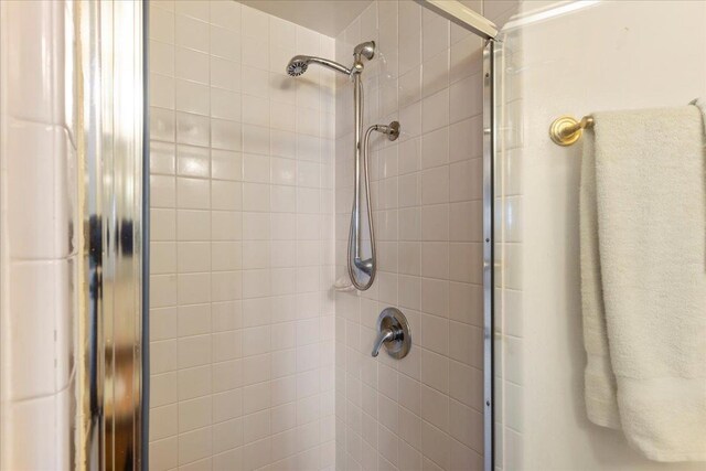 bathroom view of tiled shower