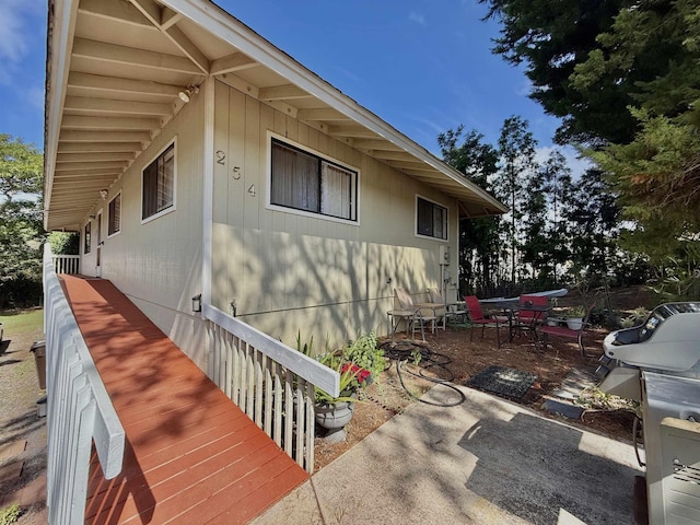 view of side of home featuring a patio area