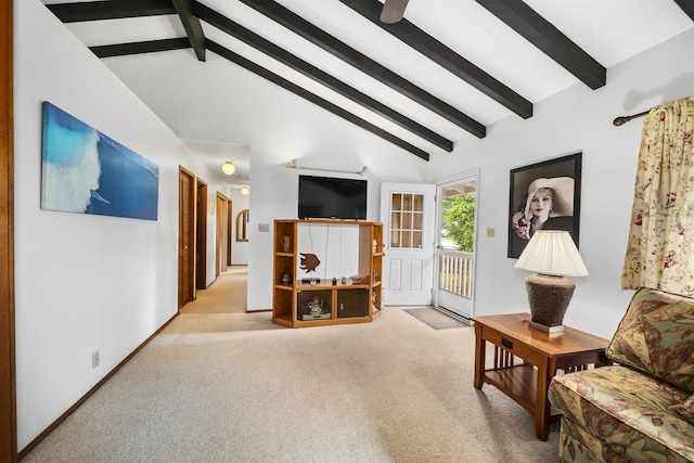 carpeted living room featuring beamed ceiling and high vaulted ceiling