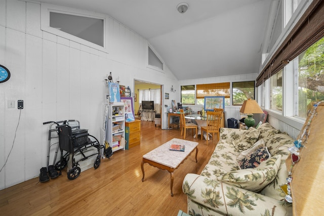 living room with lofted ceiling and hardwood / wood-style floors