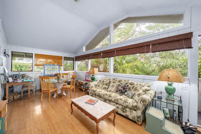 sunroom featuring lofted ceiling