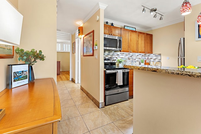 kitchen with light stone countertops, light tile patterned floors, crown molding, and appliances with stainless steel finishes