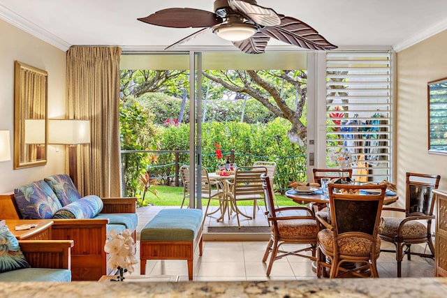 sunroom / solarium featuring ceiling fan