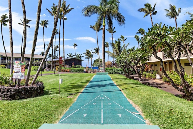 view of home's community with a yard